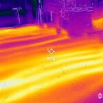 A thermal image of a floor in a garage.