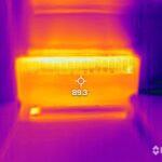 A thermal image of a room with a light on it.